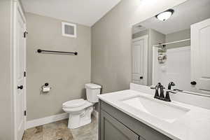 Full bath with vanity and a shower