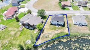 Aerial view of residential area featuring property parcel outlined