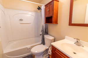 Bathroom with shower / tub combo and vanity