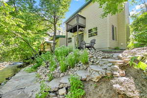 Stairs to lower patio next to the river.