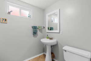 Bathroom with toilet and tile patterned floors