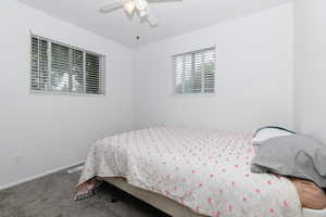 Bedroom with carpet floors and a ceiling fan