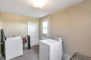 Washroom featuring independent washer and dryer