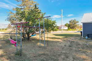 View of jungle gym featuring a yard