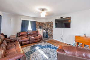 Living room featuring wood finished floors and baseboards