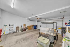 Garage featuring a garage door opener