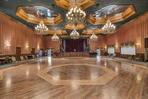 Community lobby with a high ceiling and crown molding