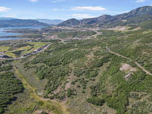 Aerial view of property's location featuring a water and mountain view