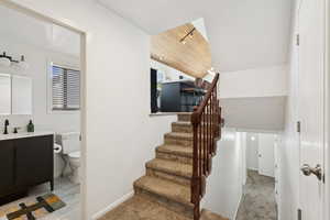 Access to kitchen, guest bath, family room and lower level