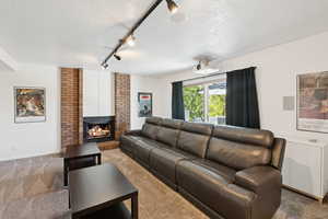 Main area family room with fireplace and walks out to deck