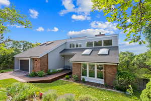 View of front of house featuring new roof and skylights