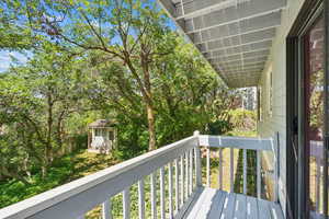 View of balcony and private back yard