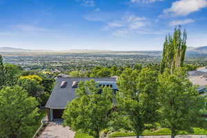 Aerial view of property and surrounding area featuring view of the valley