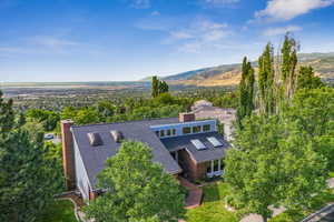 Aerial view of home with mountain and valley views