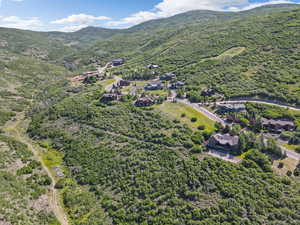 Aerial overview of property's location with a mountainous background