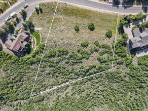 Aerial view of property and surrounding area with property boundaries highlighted