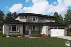 Prairie-style house with stone siding, concrete driveway, and a front yard