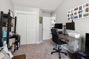 Bedroom/Home office with carpet floors and baseboards