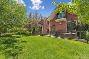 Rear view of property featuring a balcony