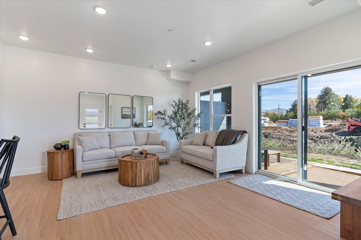 Living room featuring light wood-type flooring and recessed lighting