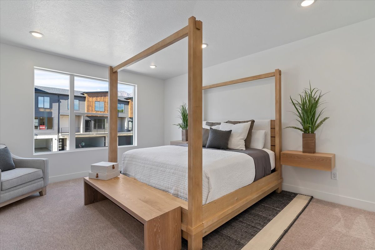 Carpeted bedroom featuring recessed lighting and a textured ceiling