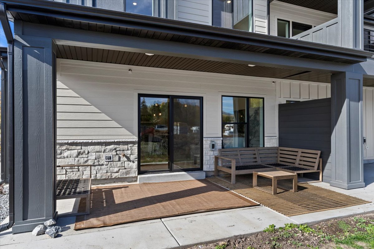 Property entrance with stone siding