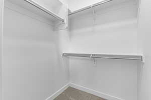 Spacious closet with carpet floors