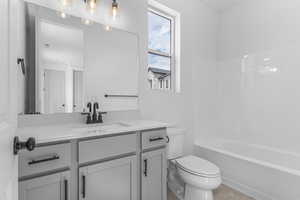 Full bath with vanity and tub / shower combination