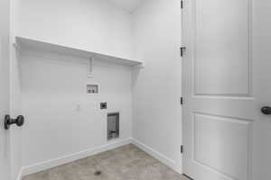 Laundry area with electric dryer hookup and washer hookup