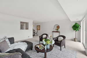 Living area with carpet and ornamental molding