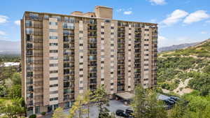 View of apartment building / complex featuring a mountain view
