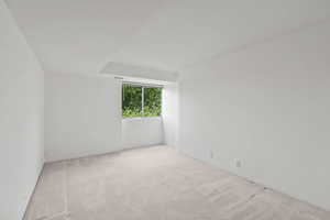 Unfurnished room with carpet flooring