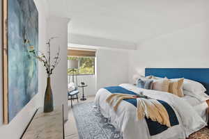 Carpeted bedroom with crown molding and a textured ceiling