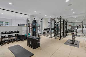 Workout area featuring recessed lighting