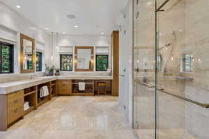 Bathroom with double vanity, a stall shower, recessed lighting, and marble finish flooring