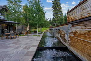 View of patio / terrace featuring outdoor dining area and a water view