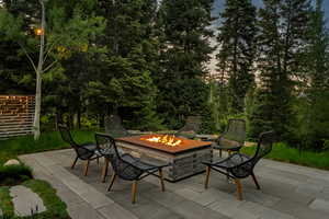 View of patio featuring an outdoor fire pit