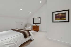 Bedroom with carpet, lofted ceiling, and recessed lighting