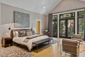 Bedroom with high vaulted ceiling and recessed lighting