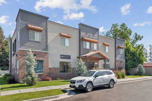 View of front of house featuring brick siding