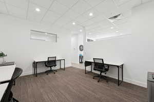 Office space with recessed lighting and a drop ceiling