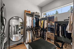 Walk in closet featuring wood finished floors