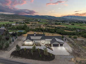 View of subject property with a mountainous background