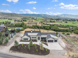 Overview of rural landscape featuring a mountain backdrop