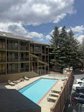 Community pool featuring a patio area