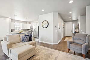 Living room featuring wood finished floors and recessed lighting