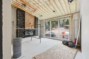 Sunroom featuring vaulted ceiling
