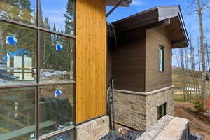 View of home's exterior with stone siding
