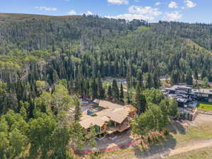 View from above of property with a heavily wooded area