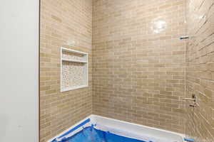 Bathroom with tiled shower